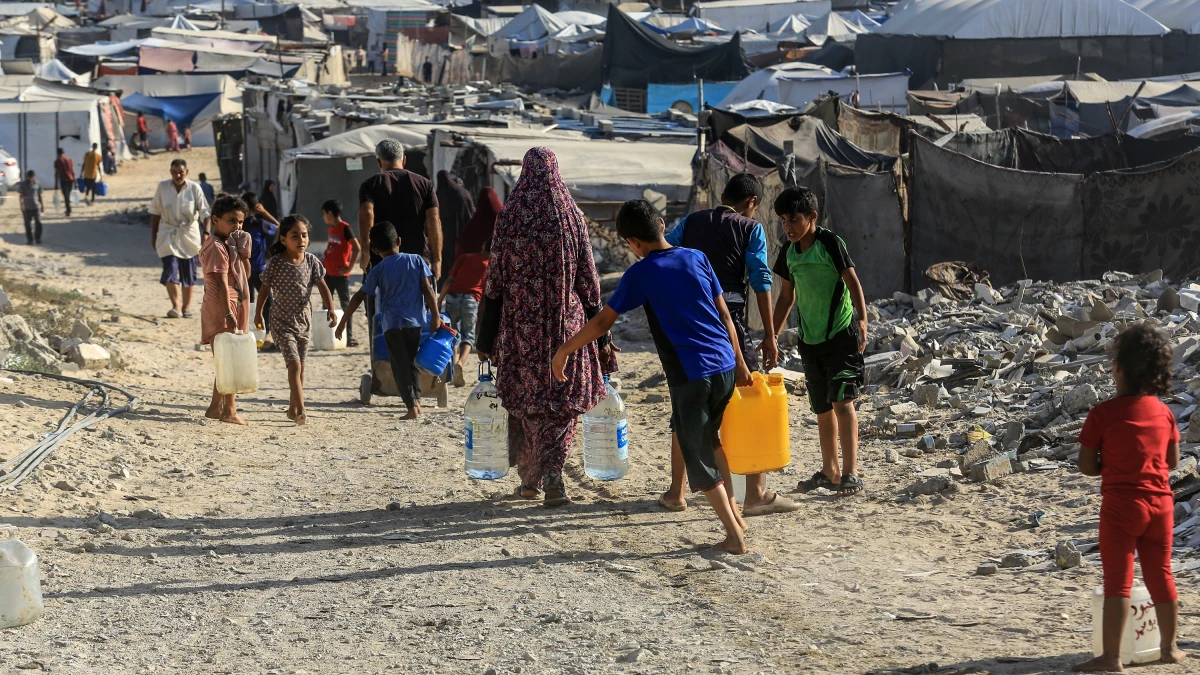 Displaced Palestinians fill gallons of drinking water in Khan Yunis, southern Gaza Strip. Palestinians in the Gaza Strip are suffering from a water crisis, on July 6, 2025.