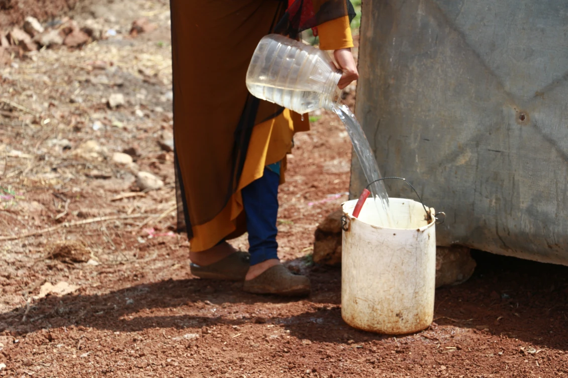Flood-affected camp, where we distribute cash aid, Adwan/NWS