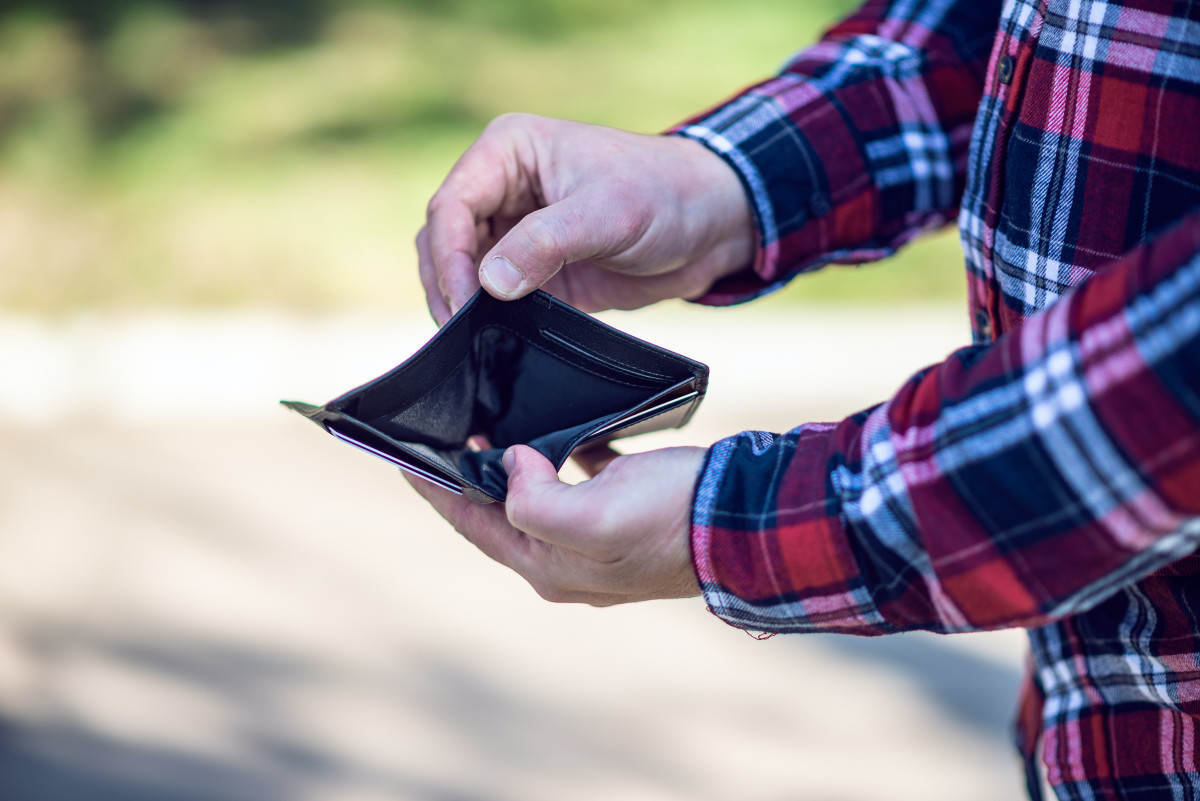 a person displays an empty wallet