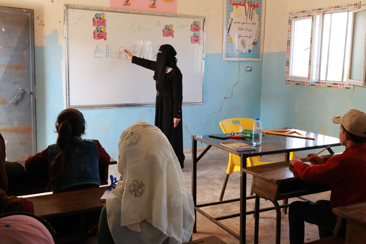 Ms. Maisa teaching the alphabet