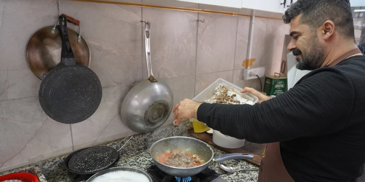 Man cooking in his restaurant.