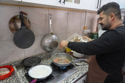 Man cooking in his restaurant. 