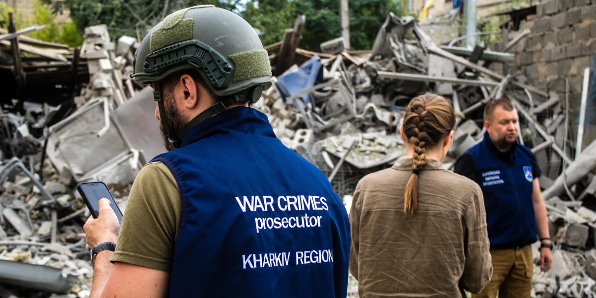 War crimes prosecutors and police intervene following an airstrike with a Russian UMPK KAB 250 guided bomb on the Avtorska Shkola Boyko school in Kharkiv. The debris is collected for analysis