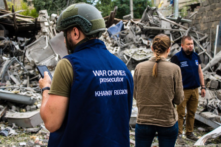 War crimes prosecutors and police intervene following an airstrike with a Russian UMPK KAB 250 guided bomb on the Avtorska Shkola Boyko school in Kharkiv. The debris is collected for analysis