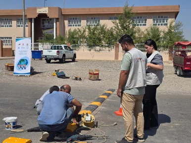 The installation of the speed bump in front of the school to ensure safety for the students