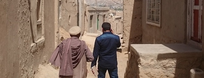 Afghan Safia ran out of her house, moments later it collapsed because of an earthquake. Her father is building a new one now