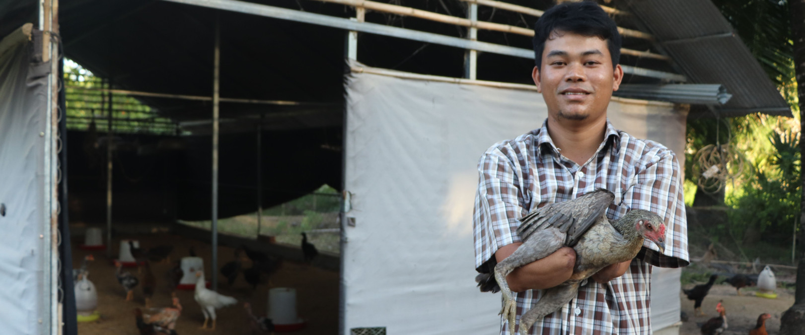 Ponlork’s arms required amputation. Now he makes a living as a successful poultry farmer in Cambodia
