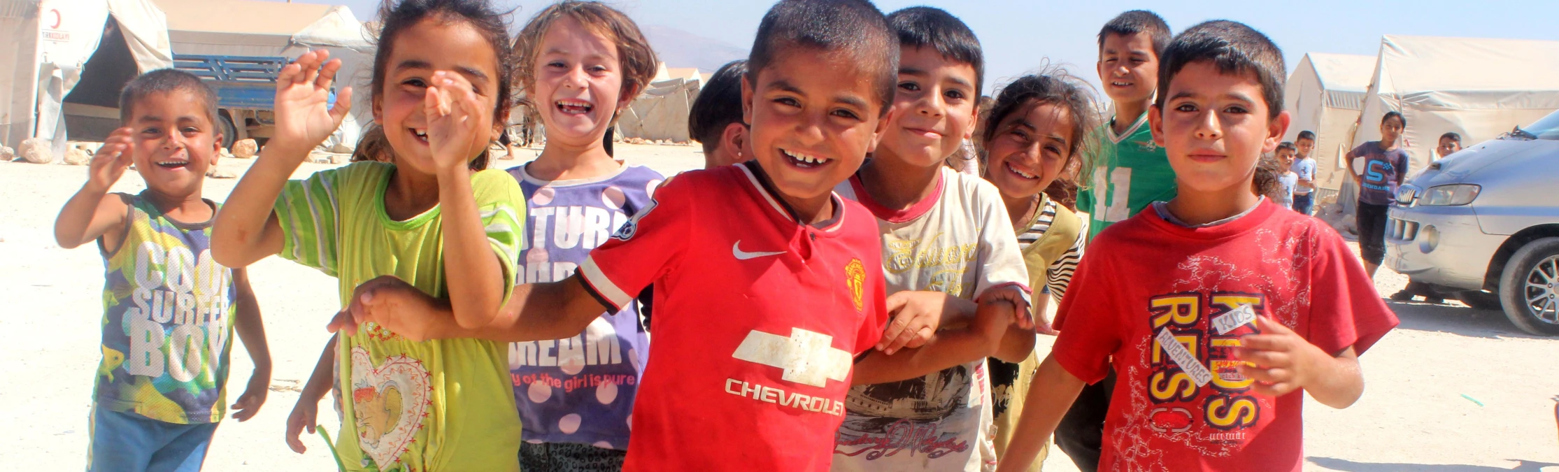 “No classrooms, no desks, no salaries, no heating, no books,” yet not giving up on education 