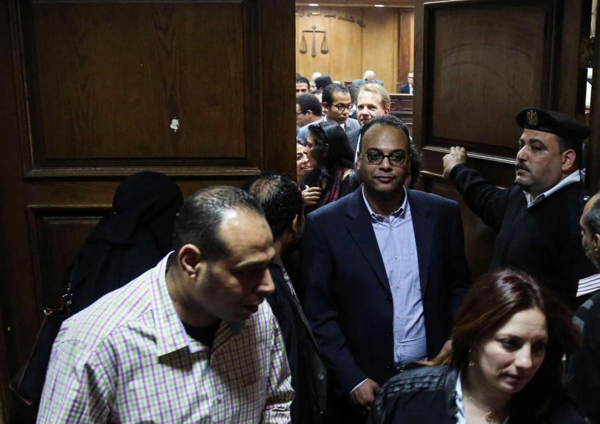 Prominent rights activist and journalist Hossam Baghat, center, leaves a courtroom at the Cairo Criminal Court on March 24, 2016. In recent years, Egyptian authorities have relentlessly prosecuted leading human rights and civil society activists. AP Photo