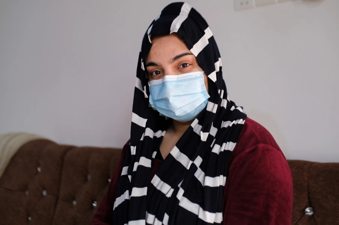 Safa, 25, posing at her house in Beiji, Iraq. 