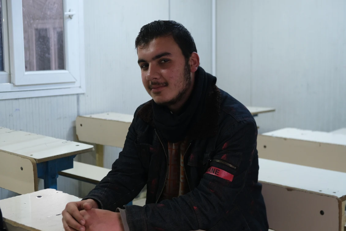 Mostafa, 16, sitting in one of our classrooms at Basrma camp in northern Iraq.