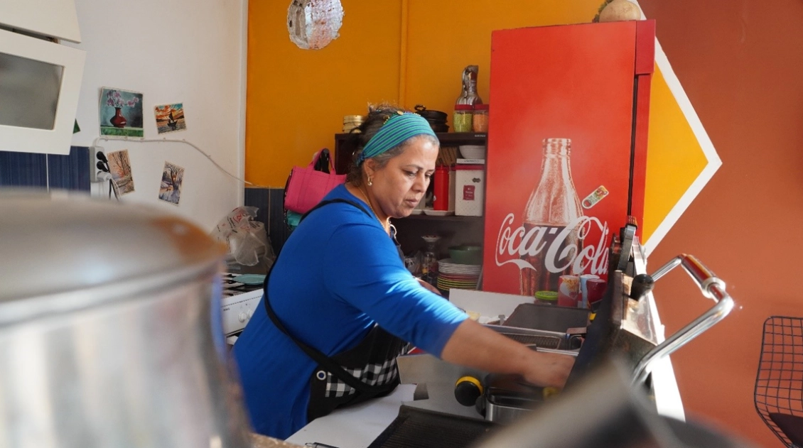Emine at work in her shop.