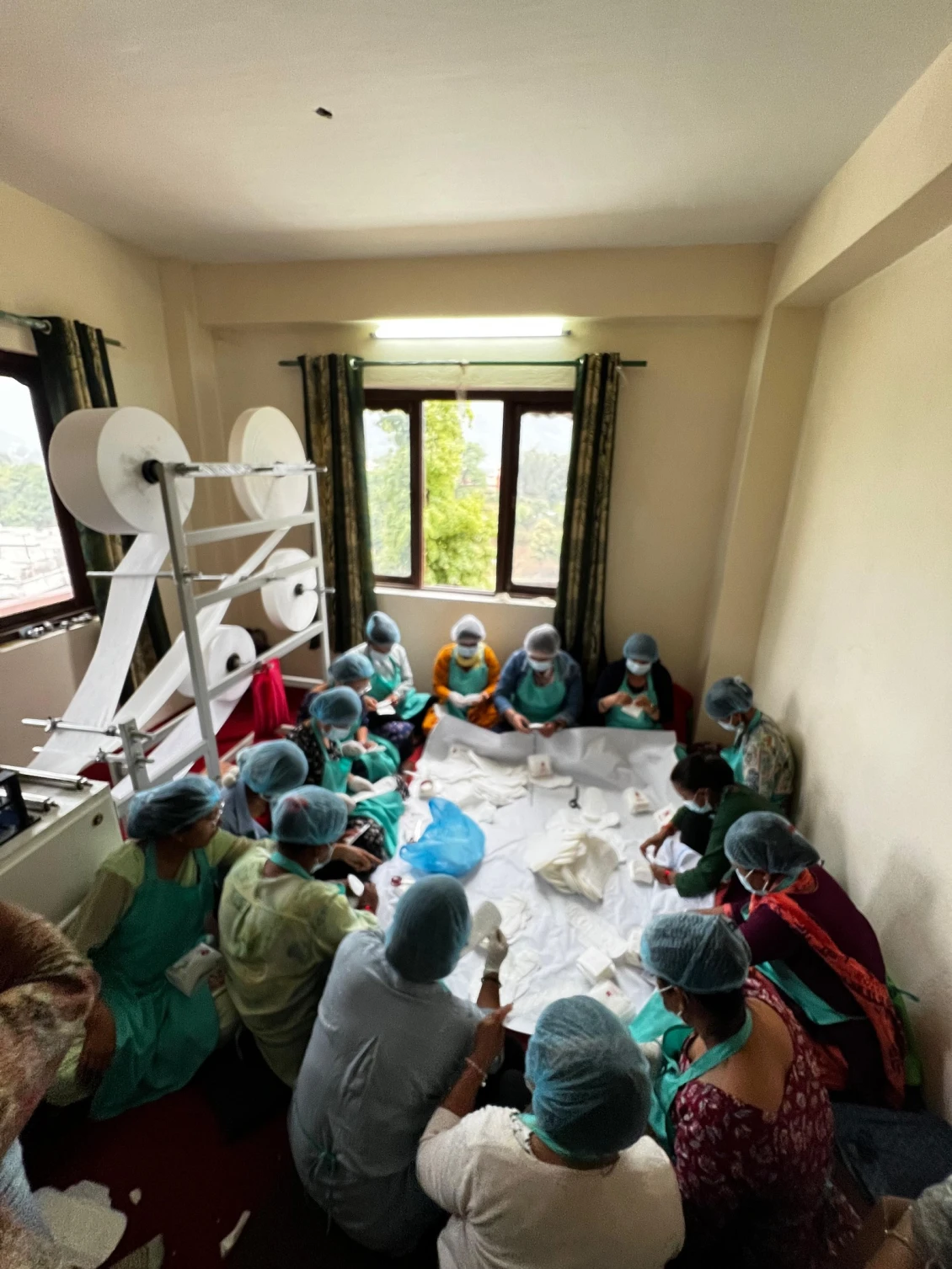 Sanitary napkin manufacturing unit