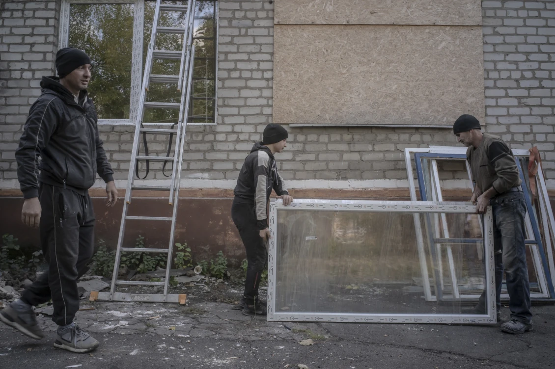 Workers install new windows in Kramatorsk's Hospital No. 3, which serves children and adults.