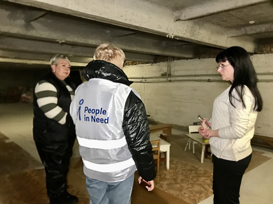 The director of the centre shows rooms that need repair 
