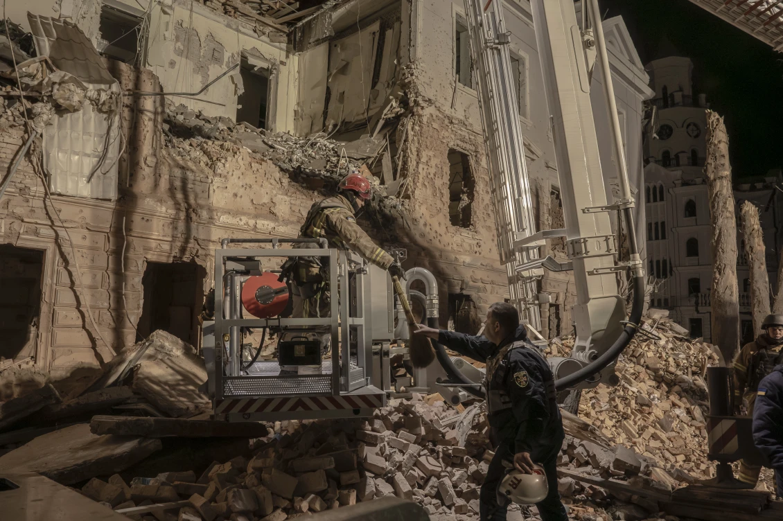 At the site of the Palm Sunday attack in central Sumy, Ukrainian emergency workers clear rubble left by two Russian ballistic missile strikes that killed 36 and wounded more than 100. 