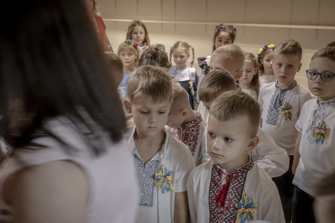 Children descend into the school shelter
