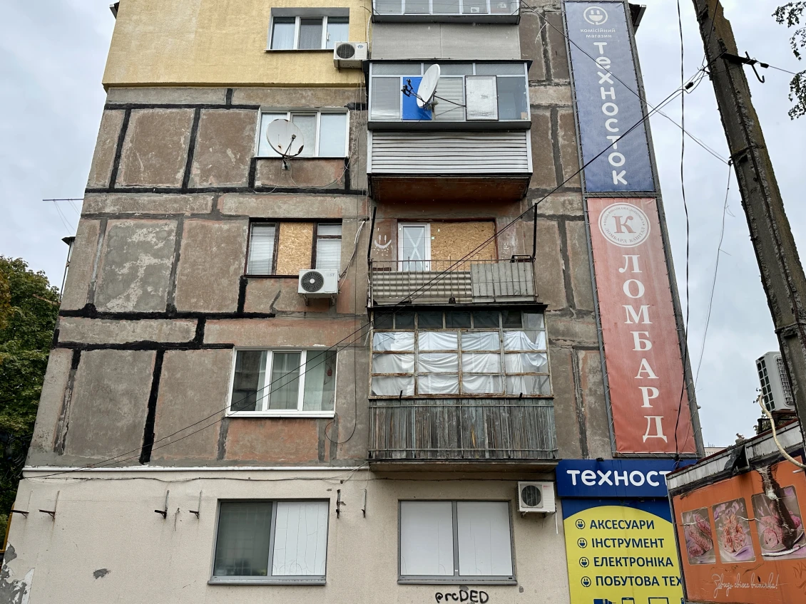 Many houses in Marhanets have boarded up windows 