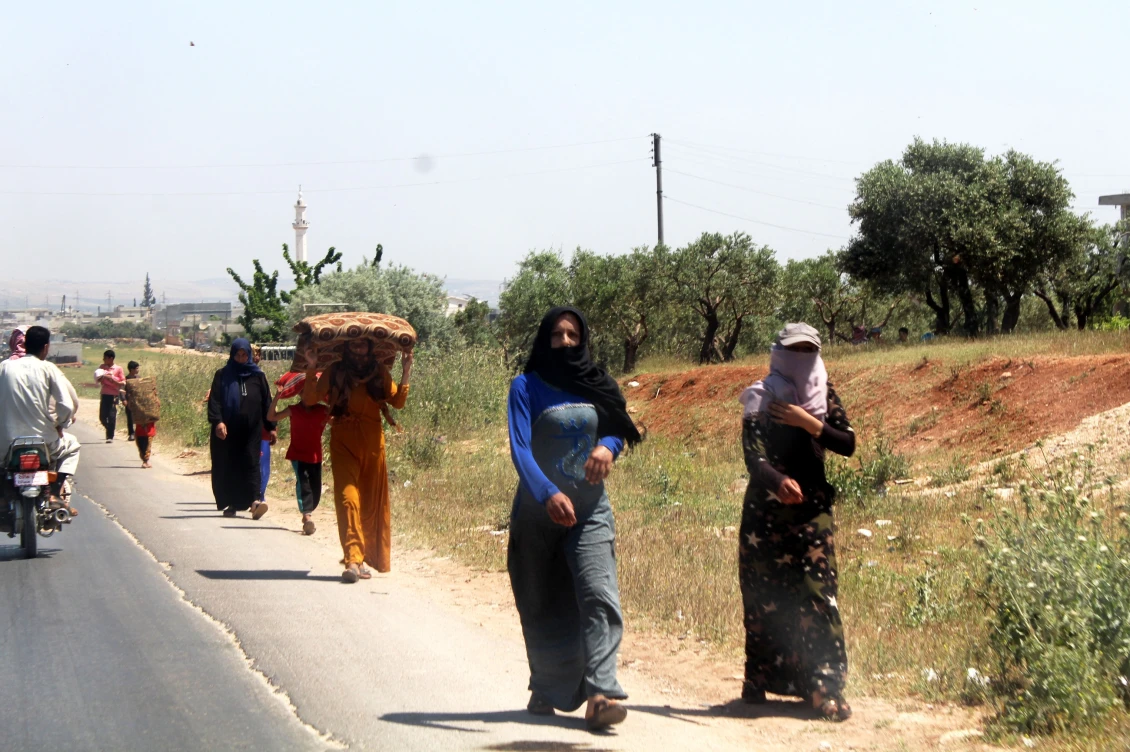 Families fleeing north to escape the violence, and camping under trees or in open fields because of a lack of shelter.