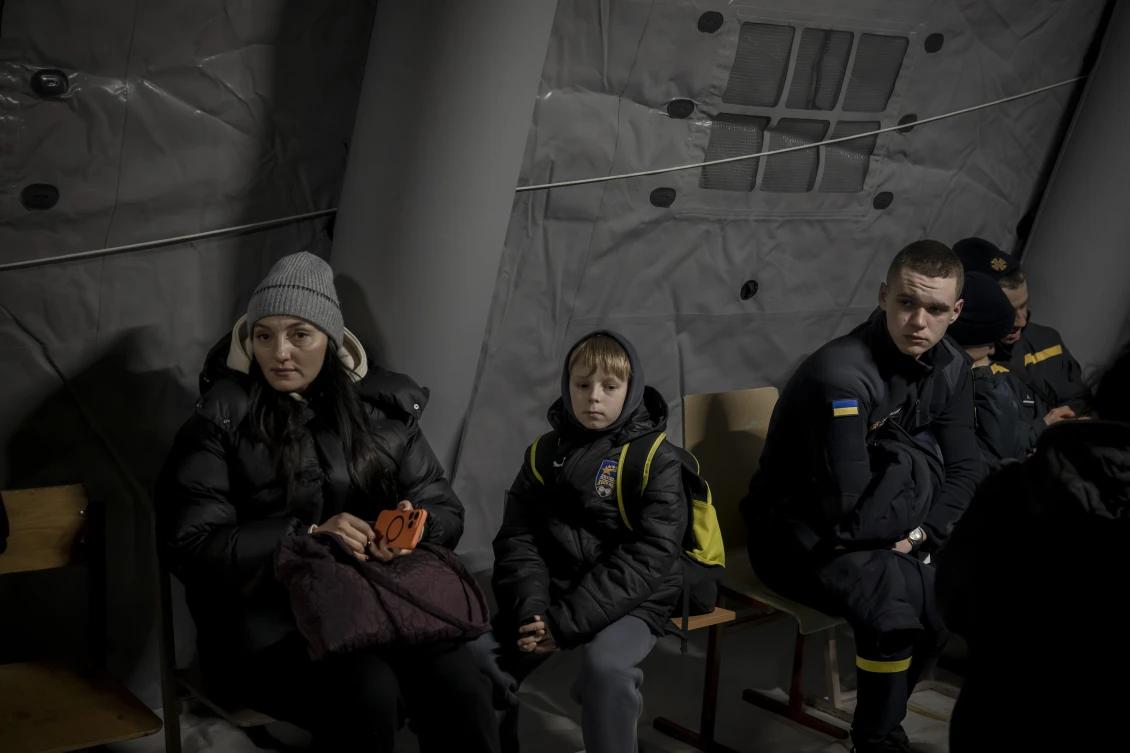 Residents and emergency services inside an invincibility point in Kyiv