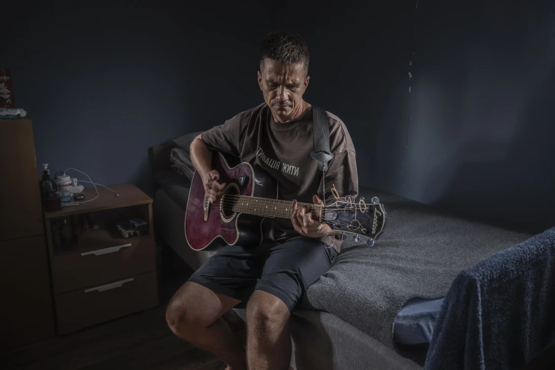 In his spare time Dmytro plants flowers, waters the thuja trees, and in the evenings finds solace in music