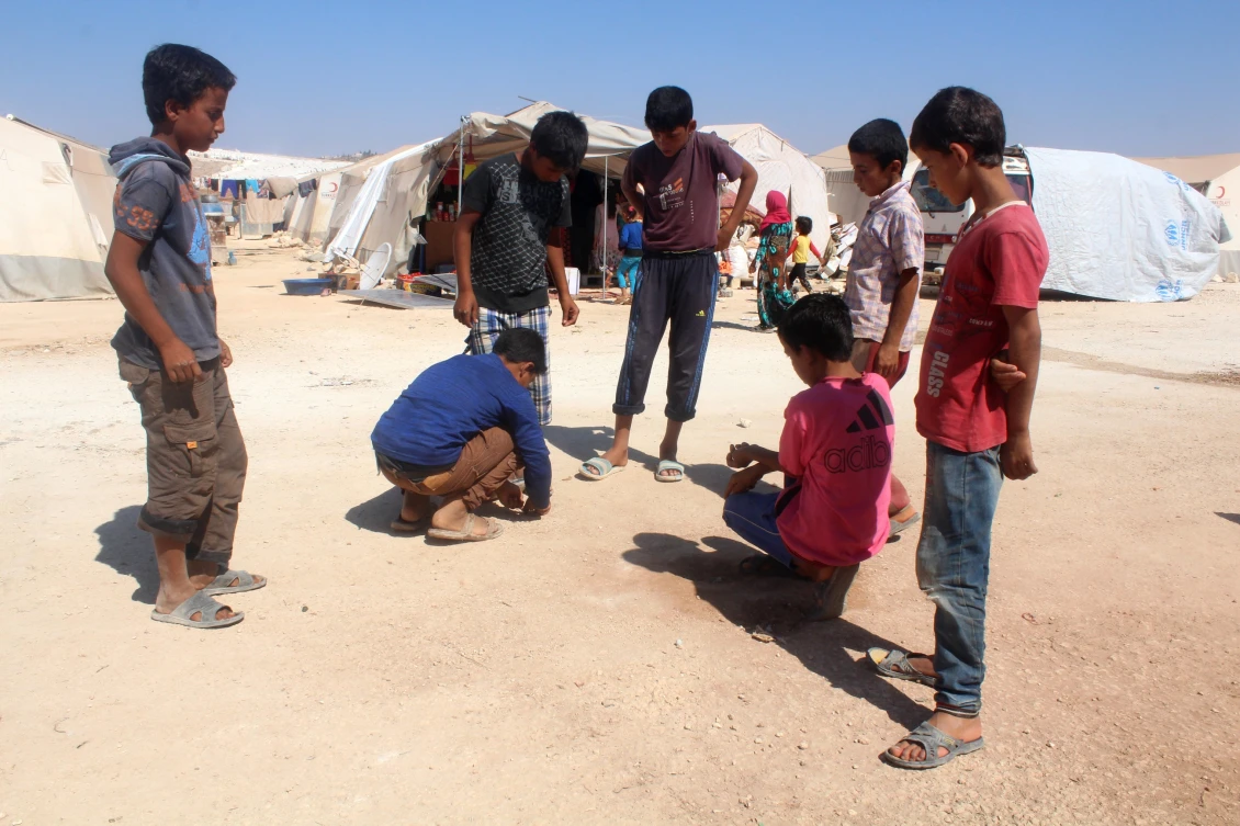 Children creating their own games in Majd’s displacement camp, Idlib north, where until recently there were no education facilities. 